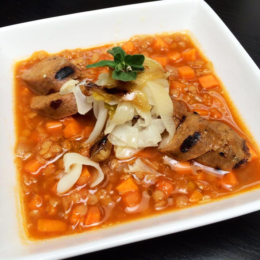 Curried Lentils with Slow-charred Spring Onions & Grilled Smoked Apple Sage Sausage